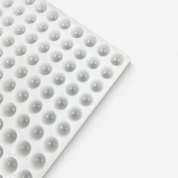 Close-up of the half-sphere cavities on a 2.8mL commercial silicone gummy mold