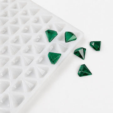 2mL diamond gummy mold with 179 cavities and translucent emerald green gummies on a white background