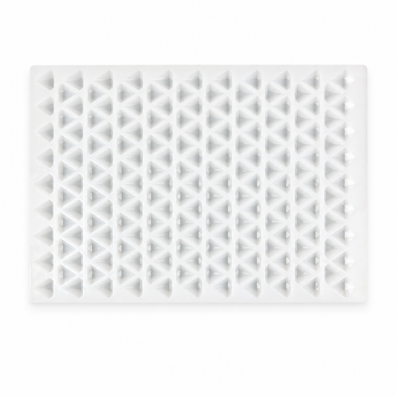 Full vertical top view of an empty 2mL diamond gummy mold with 179 cavities on a white background