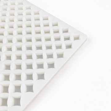 Close-up of an empty 2mL star gummy mold with 192 cavities on a white background