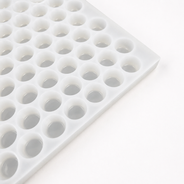Close-up of an empty 3mL gumdrop gummy mold with 262 cavities on a white background